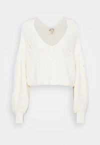 Gekürzter, locker gestrickter Pullover in Off-White. Verfügt über einen tiefen V-Ausschnitt, gerippte Bündchen und strukturierte Ärmel mit strukturierter Zopfmusterung.