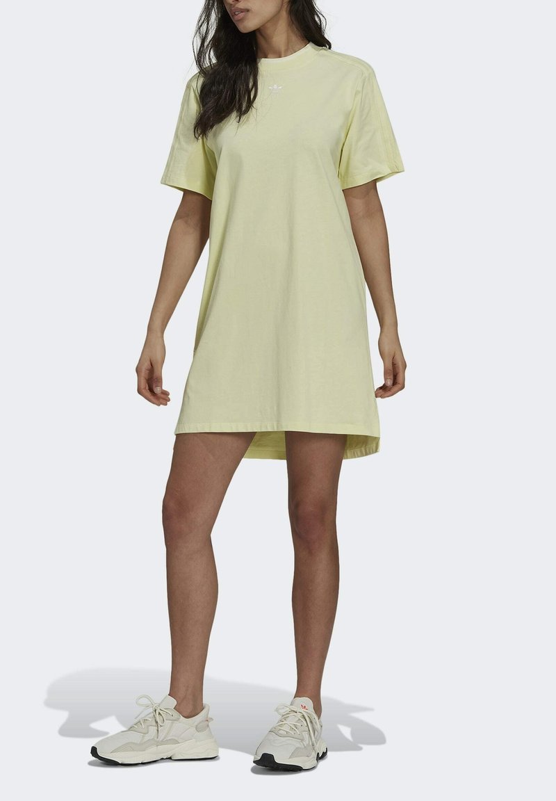 Yellow cotton t-shirt dress with a relaxed fit, crew neckline, and short sleeves, featuring a subtle logo on the chest.