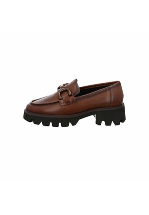 Brown leather loafers with a chunky black rubber sole, featuring a decorative buckle detail and smooth texture.