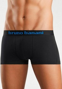 Male torso wearing black fitted boxer briefs with a blue "bruno banani" waistband logo on a plain background.