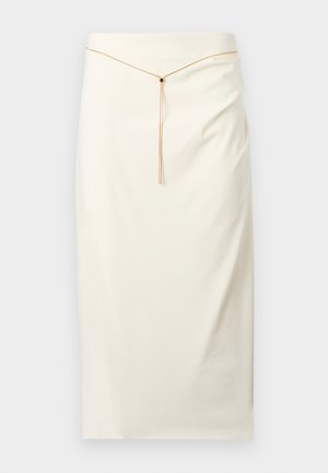 Kirjuvalge põlveni ulatuv pliiatsseelik, millel on õhuke kuldne kettvöö ning ees keskosas väike must aktsent.