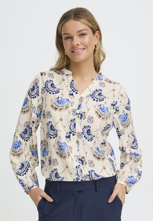 Bluse mit Blumenmuster in Blau-, Beige- und Brauntönen, mit langen Ärmeln, einem Kragen und einer Knopfleiste vorne.
