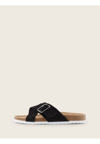 Svart mockaskinn slip-in sandaler med ett spänne, korkfotsäng och vit gummisula. Har en design med korsremmar för komfort.
