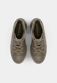 Brown leather high-top sneakers with round toe, flat laces, and metal eyelets. Features textured surface and branded inner sole.