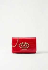 Red faux-crocodile leather wallet with a gold chain strap and embossed logo. Features a flap closure and glossy finish.