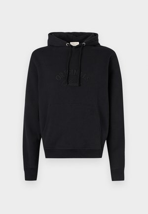 Black hoodie made of soft fabric, featuring a front pocket, drawstring at the hood, and embossed "ORIGINALS" logo on the chest.