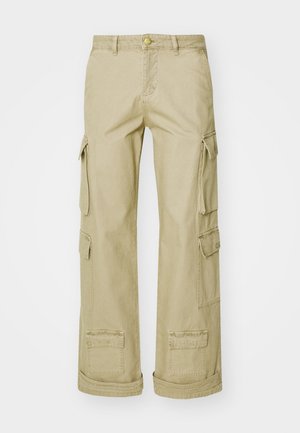 Beige cargo pants made from durable fabric, featuring multiple side pockets, a button closure, and a relaxed fit.