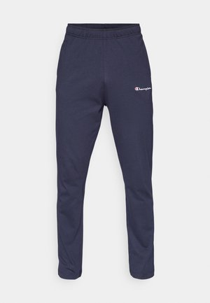 Navy sweatpants with an elastic waistband, tapered legs, and a small white "Champion" logo on the upper left side. Soft fabric texture.