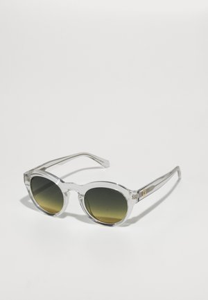 Clear, oval-frame sunglasses with dark gradient lenses. Transparent arms with subtle gold accent details. Smooth, glossy finish.