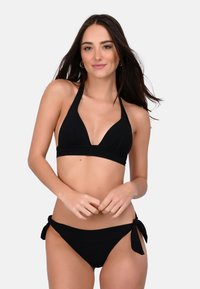 Black bikini set featuring a triangular halter neck top and low-rise bottom with side ties. Smooth fabric with minimalistic design.