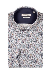 Witte blouse met een bloemenpatroon in rood, blauw en geel. Beschikt over een moderne pasvorm, knoopmanchetten en een donkere binnenkraag. Ontworpen door Giordano.
