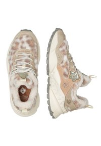 Textured beige sneakers with a fuzzy finish, floral accents, light grey sole, and cream laces. Notable soft lining and unique design details.