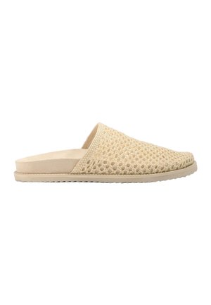 Beige slip-on mule with woven upper and flat sole, featuring open-weave design for breathability and a cushioned footbed.