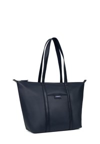 Marineblauwe tote bag van textuurmateriaal, heeft twee lange handvatten en een rechthoekige vorm. Ritssluiting en subtiele accentdetails.