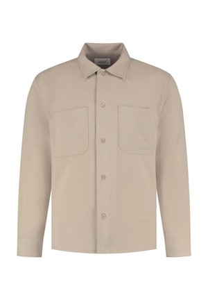 Beige Langarmhemd mit zwei Vordertaschen, Knopfleiste und Kragen. Hergestellt aus einem glatten, strukturierten Stoff.