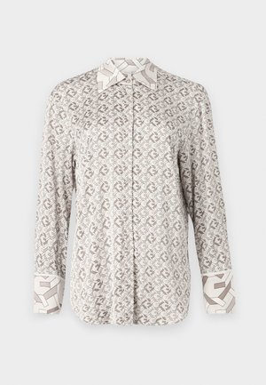 Camicia button-up di un beige chiaro con un motivo geometrico. Caratterizzata da maniche lunghe e colletto e polsini a contrasto con un design simile.