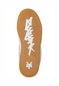 Shoe sole in white and gum rubber, featuring a zigzag pattern and bold white graphic text. Textured grip details across the surface.