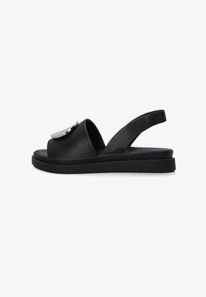 Sorte lædersandaletter i slingback-stil har en glat overflade, rund åben tå, tyk sål og en metallisk accent på overdelen.