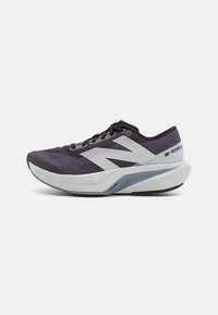 Purple athletic shoe with a mesh upper, white accents, and a thick, cushioned gray sole featuring a textured design.