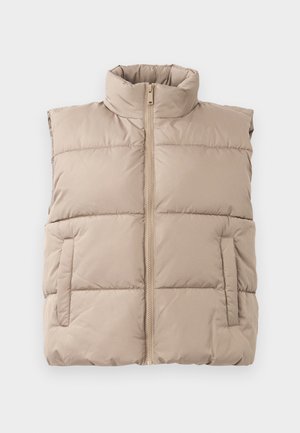 Gilet sans manches rembourré beige avec col montant, fermeture éclair frontale et deux poches latérales, posé à plat sur un fond blanc.