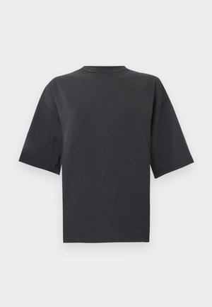 Svart oversized T-skjorte med korte ermer og rund hals, lagt flatt på en lys bakgrunn.