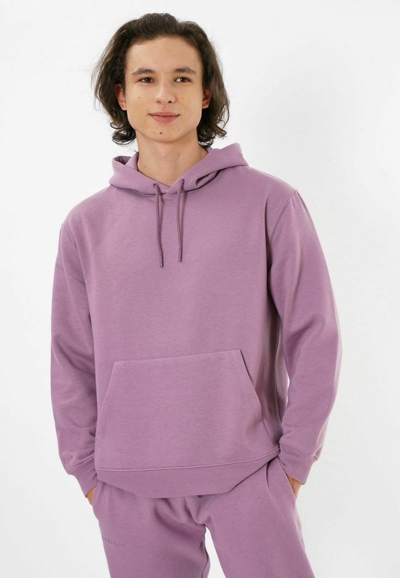 Lavender hoodie made of soft fabric, featuring a kangaroo pocket, drawstring hood, and ribbed cuffs, paired with matching sweatpants.