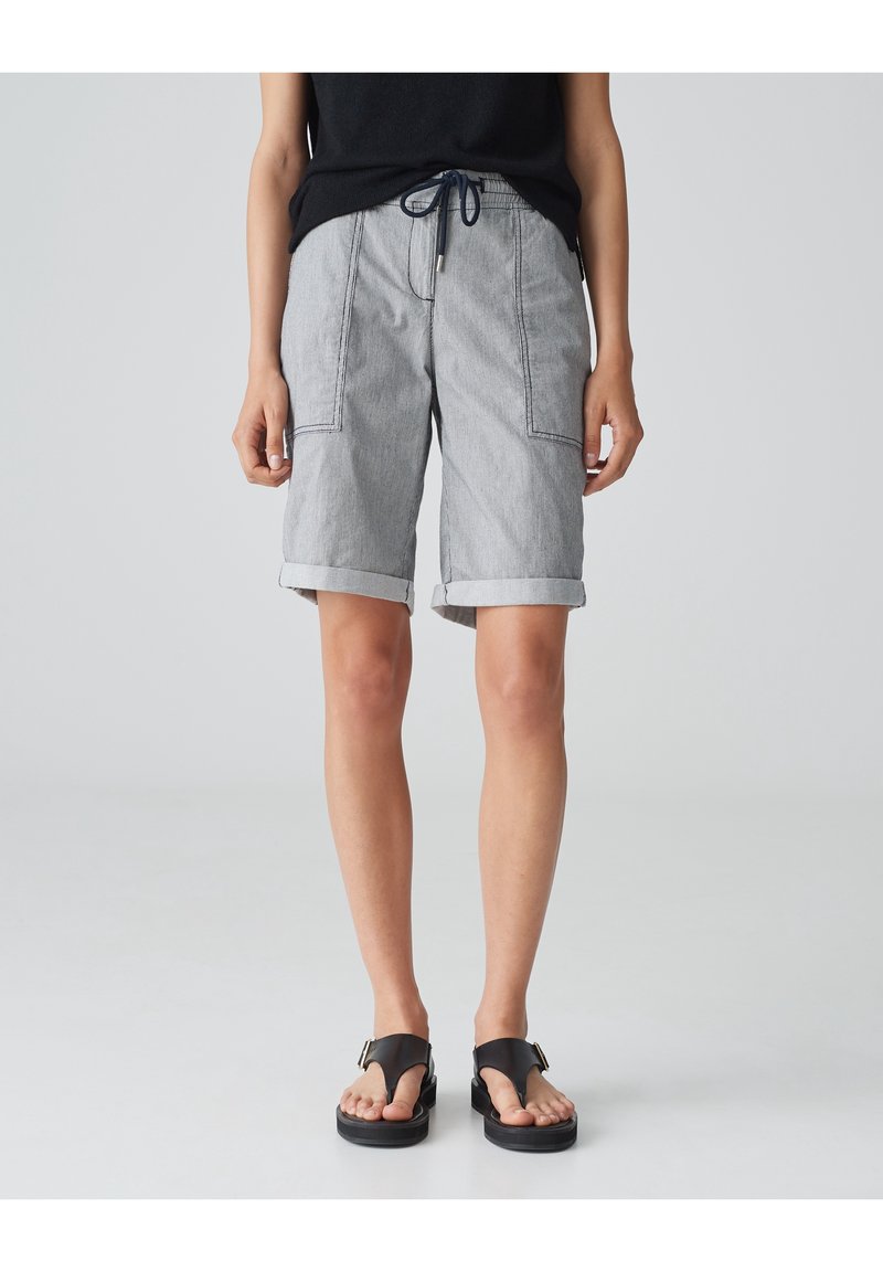 Gray striped shorts with rolled cuffs, featuring side pockets and a drawstring waistband, paired with black flip-flop sandals.