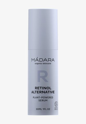 Ljuslila cylindrisk flaska med Retinol-alternativ serum. Har svart text och EcoCert-logotyp. Volym: 30 ml (1 fl oz).