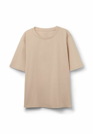 Beige t-shirt med korte ærmer og rund hals med løs pasform, vist mod en hvid baggrund.