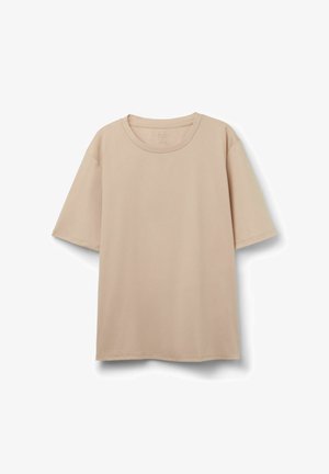 Beige t-shirt med korte ærmer og rund hals med løs pasform, vist mod en hvid baggrund.