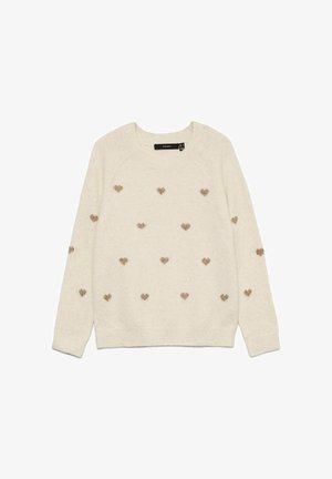 Suéter crema hecho de una tela suave, con pequeños corazones dorados bordados dispersos por la superficie. Cuello redondo y puños acanalados.