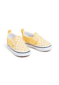 Des chaussures à enfiler à carreaux jaunes avec des accents blancs, dotées d'une semelle en caoutchouc, d'une tige en toile et de tirettes pour un enfilage facile.