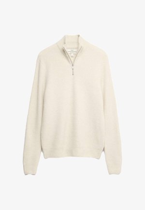 Pull crème clair avec un col zippé, texture côtelée et manches longues. Matière en tricot douce avec une silhouette simple.