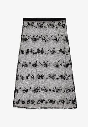 Črna čipkasta krila z cvetličnim vezenjem in bleščicami. Ima oprijet pas in tekočo A-linijo. Teksturna zasnova poudarja obliko.