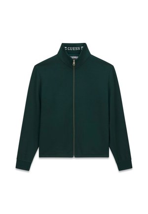 Dunkelgrüne Jacke mit Reißverschluss, langen Ärmeln und Stehkragen, die den Markennamen Guess innen am Kragen zeigt.