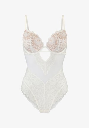 Nėriniuotas bodis su formuotais puodeliais ir reguliuojamomis petnešėlėmis. Savybės: gilus V išpjovimas ir baltos spalvos gėlių nėrinių raštas, su permatomomis dalimis ir banguotomis kraštinėmis.