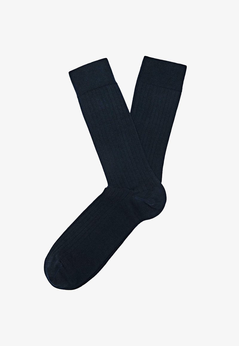 Calzini a coste blu scuro con una texture liscia e punta rinforzata. Presentano un polsino confortevole per una vestibilità sicura.