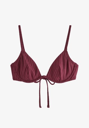 Bordeauxfarvet ribstrikket stof-bh med tynde justerbare stropper, bøjlede kopper og en knudedetalje foran.