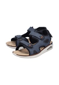 Navy blue sandal with Velcro straps, open design, cushioned beige insole, white rubber outsole, and black accents.
