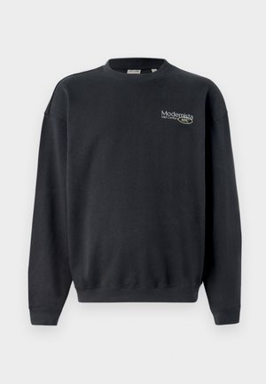 Sweatshirt preto de algodão com punhos e bainha canelados. Apresenta um pequeno logotipo em texto de cor clara e um design de ajuste relaxado.