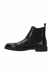 Black leather Chelsea boot with elastic side panels, rounded toe, and a flat rubber sole. Features a pull tab on the heel for easy wear.