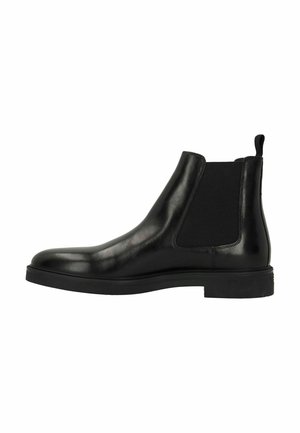 Black leather Chelsea boot with elastic side panels, rounded toe, and a flat rubber sole. Features a pull tab on the heel for easy wear.