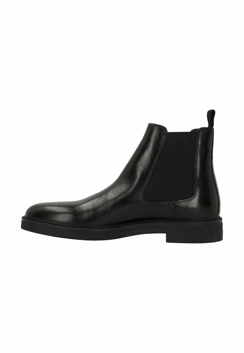 Black leather Chelsea boot with elastic side panels, rounded toe, and a flat rubber sole. Features a pull tab on the heel for easy wear.
