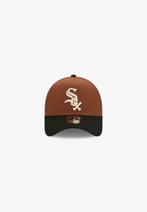 Brown cap with a black brim, featuring an embroidered white logo on the front. The fabric is smooth, and the design is structured.