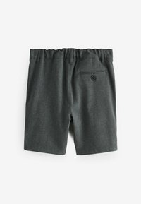 Grå shorts i textil med struktur, med elastisk midja, en enkel bakficka med knapp och en ren, skräddarsydd design.