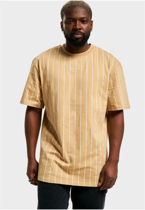 Short-sleeve beige shirt with white vertical stripes and a signature logo on the chest. Made from soft cotton fabric.