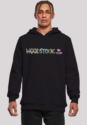 Black hoodie featuring multicolored "WOODSTOCK" text, a purple bird graphic, front pocket, drawstring hood, and ribbed cuffs.