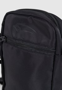 Black fabric backpack with a smooth texture, featuring a zippered compartment and a subtle logo design on the front.