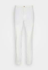 Pantalon décontracté blanc avec poignets élastiques, taille à bouton et cordon, présenté à plat sur un fond uni.
