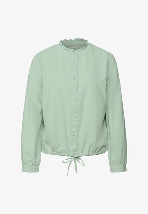 Lysegrøn skjorte med knapper, rynket krave, lange ærmer og elastisk talje. Indeholder en snøre i bunden.